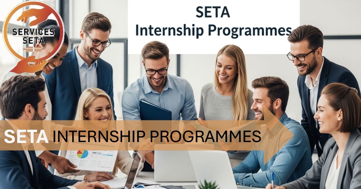 group of young adults (men and women of different ethnic backgrounds) in a modern office setting, smiling and collaborating around laptops and paperwork. A banner or text in the background says "SETA Internship Programmes".